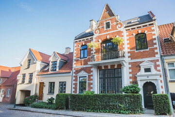 Fototapeta na wymiar Viborg, Denmark, August 2018: Cozy two-story houses with hedges in Denmark