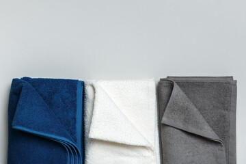 Three towel blue, white and gray colors. Top view flat lay copy space