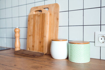 cozy home, kitchen organization, wooden serving boards and food storage jars