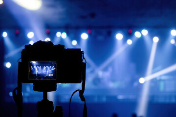 Concept of production in pubs and concert events, camera shooting beams from spotlights and lights...
