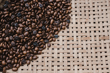 Concept Coffee: The roasted coffee beans are then placed on a wooden net to cool down.