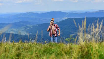 Naklejka premium Rocking the wave. sexy man with guitar in checkered shirt. hipster fashion. western camping and hiking. happy and free. cowboy man with bare muscular torso. acoustic guitar player. country music song