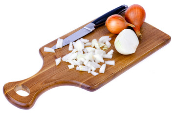 Slices of chopped onion on kitchen cutting board. Studio Photo