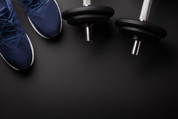 Sneakers and dumbbells. Sport, fitness and healthy lifestyle