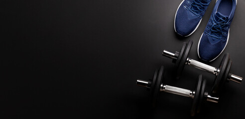 Sneakers and dumbbells. Sport, fitness and healthy lifestyle