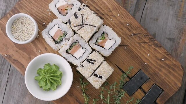 Various types of sushi are beautifully served in a rustic style. beautiful sushi serving. asian cuisine