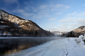 Winter theme at Hallingdalselva. A beautiful river in Hallingdal, Gol is freezing up in the cold February morning.  
