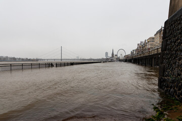 High water after heavy rainfall and snow melting in February drowned the flooded coast as weather catastrophe in Düsseldorf shows extreme weather, high tide and insurance risks at the coast with flood