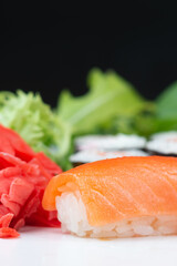 Sushi rolls with rice, herbs and soy sauce, close-up