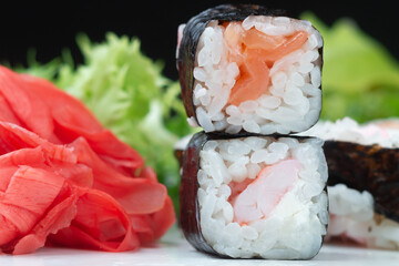 Sushi rolls with rice, herbs and soy sauce, close-up
