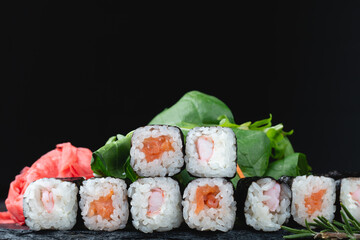 Sushi rolls with rice, herbs and soy sauce, close-up