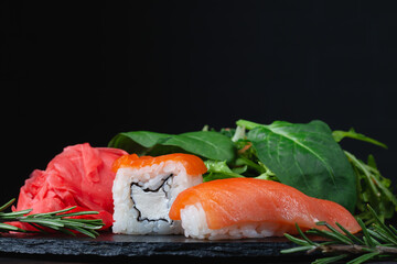 Sushi rolls with rice, herbs and soy sauce, close-up