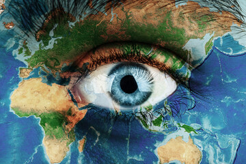 Earth continents painted on face skin, concept save the planet. Image of earth painted on face skin. Creative composition of eye and planet earth. Elements of this image furnished by NASA .