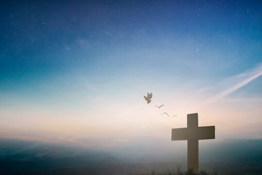 Silhouette jesus christ crucifix on cross on calvary sunset background concept for good friday he is risen in easter day, good friday worship in God, Christian praying in holy spirit religious.