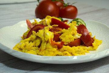 Chinese cuisine, a plate of delicious scrambled eggs with tomatoes, close-up, healthy eating
