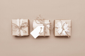 Sustainable gift boxes with blank tag. Diy packaging zero waste. Decor made from craft paper, lace...