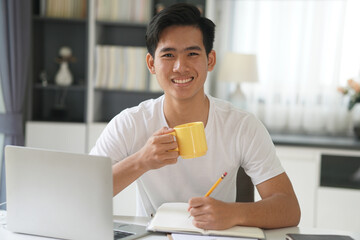 asian young student man entrepreneur working with computer studying learning online at home....