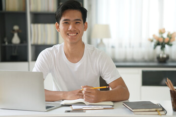 asian young student man entrepreneur working with computer studying learning online at home....