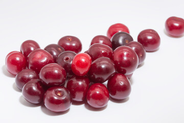 Cherry berries on a white background. Copy space.