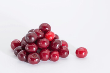 Cherry berries on a white background. Copy space.