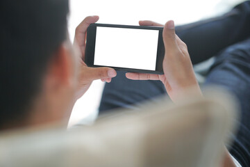 hand holdng smart mobile smartphone with white blank screen