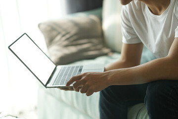 Naklejka premium asian young student man entrepreneur working with computer studying learning online at home. e-learning webinar meeting. social distance in covid pandemic