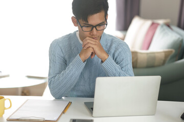 asian young student man entrepreneur working with computer studying learning online at home....