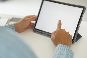 hand touching white blank screen of digital tablet