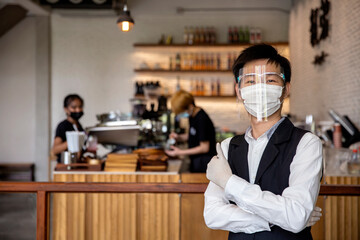 Coffee and restaurant shop owner expressed confidence in preventing COVID-19, or the coronavirus, by wearing a face mask and gloves. concept protect covid19