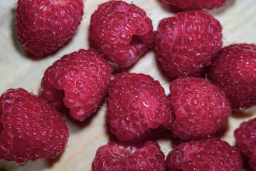 Fresh Clean Raspberry Fruits on Cutting Board