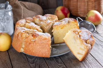 Sponge cake or chiffon cake, so soft and delicious with ingredients: eggs, flour, apples on table. Homemade bakery concept for background and wallpaper.