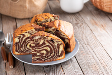 Homemade cake zebra with chocolate on rustic wooden table. Place for text