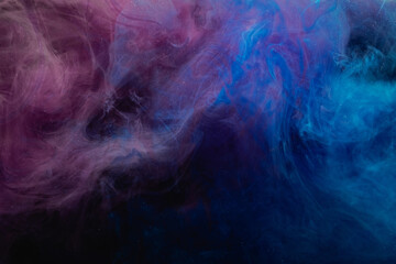 Color smoke background. Fume texture. Paint in water blend. Mystic effect. Soft pigment steam cloud design. Blue pink glitter mist floating in darkness.