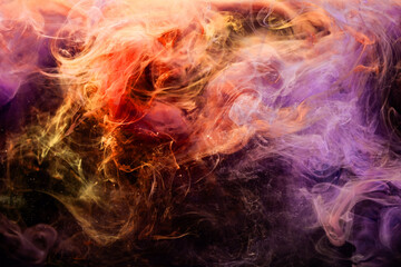 Fototapeta na wymiar Color smoke background. Paint in water splash. Fantasy design. Spiritual energy. Bright orange violet steam wave mix floating on dark.