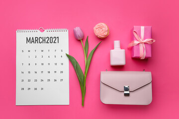 Calendar with female accessories and gift on color background. International Women's Day celebration