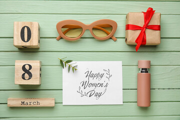 Beautiful composition with female accessories and card for International Women's Day on color wooden background