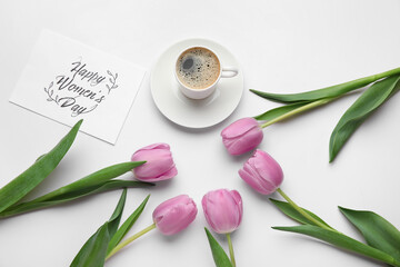 Cup of coffee, tulip flowers and card for International Women's Day on light background