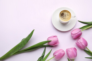 Cup of coffee and tulip flowers on light background. International Women's Day celebration