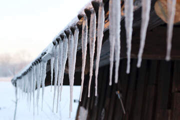 icicles on the roof at winter