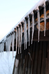 icicles on the roof at winter