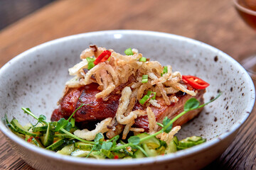 Delicious dinner in restaurant on a wooden table. Tasty food with beer in cafe or pub menu.