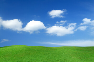 Fototapeta na wymiar Idyllic view, green hills and blue sky