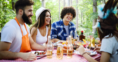 Friends having a barbecue party in nature