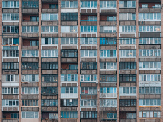 Fototapeta na wymiar Balconies on a soviet era building. Old apartment building. Front view close up.