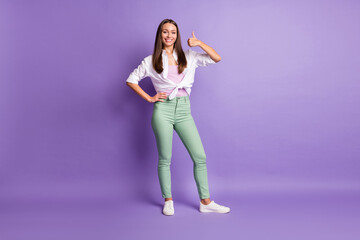 Fototapeta na wymiar Photo of young adviser woman raise thumb up toothy beaming smile wear white shirt isolated violet color background