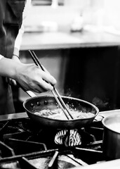 Chef cooking in a kitchen, chef at work, Black and White.
