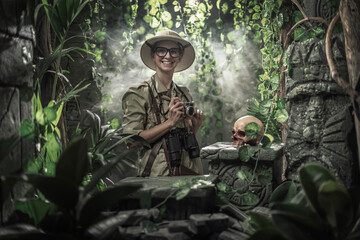 Brave explorer shooting pictures in the tropical forest