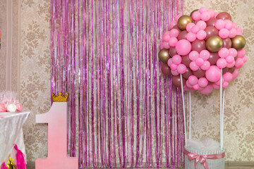 Pink photo zone for a girl on her first birthday