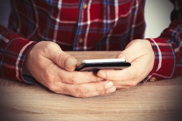 man using mobile phone, close up view