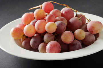 Naklejka na ściany i meble fresh grapes in the plate
